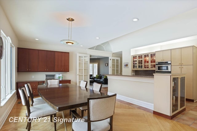 dining room featuring beverage cooler, baseboards, french doors, light wood-type flooring, and recessed lighting