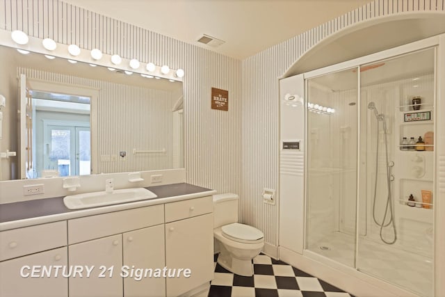 full bath featuring a stall shower, tile patterned floors, toilet, and wallpapered walls