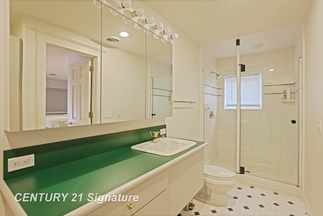 bathroom with visible vents, a shower stall, toilet, and vanity