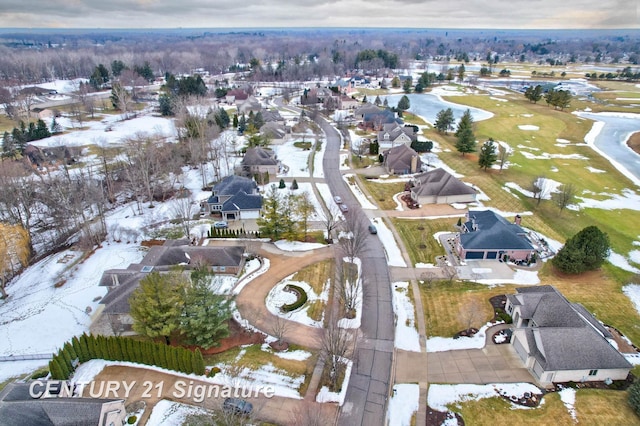 snowy aerial view featuring a residential view