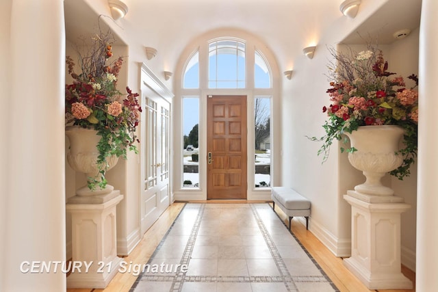 entrance foyer featuring light wood-style floors and baseboards