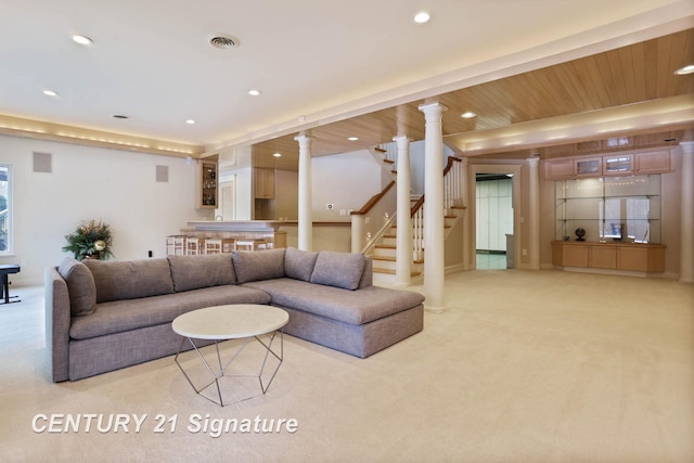 living room with decorative columns, recessed lighting, visible vents, stairway, and carpet flooring