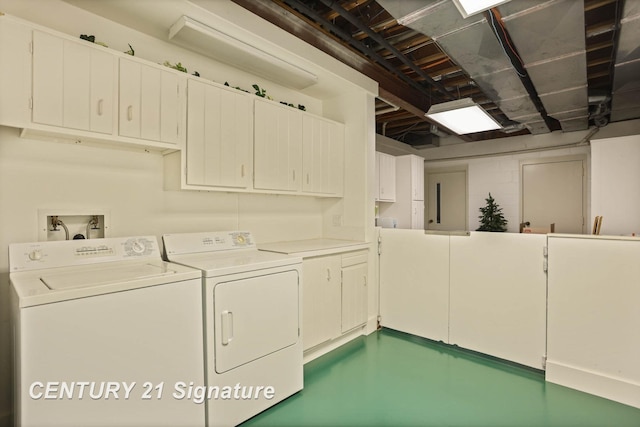 laundry area with cabinet space and separate washer and dryer