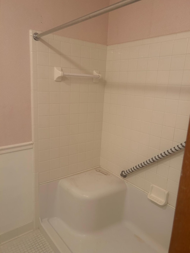 bathroom featuring tile patterned flooring and walk in shower