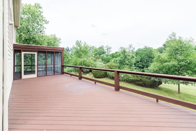 wooden deck featuring a sunroom