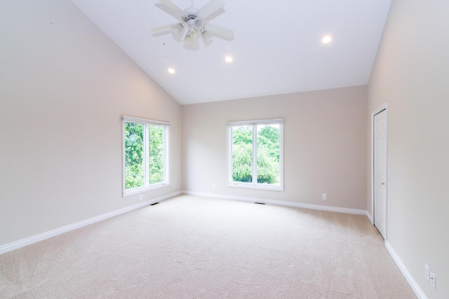 unfurnished room with baseboards, recessed lighting, and light colored carpet