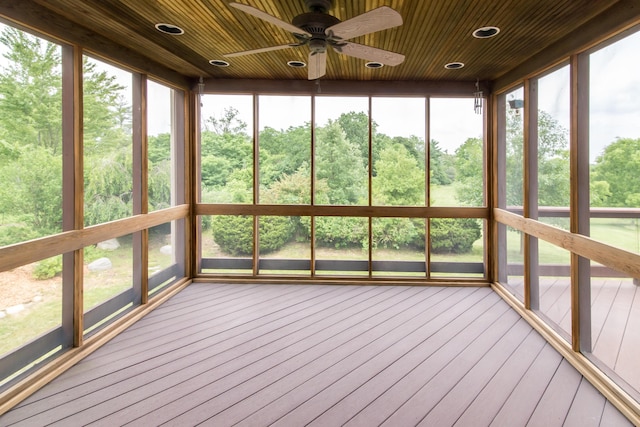 unfurnished sunroom with wooden ceiling and ceiling fan