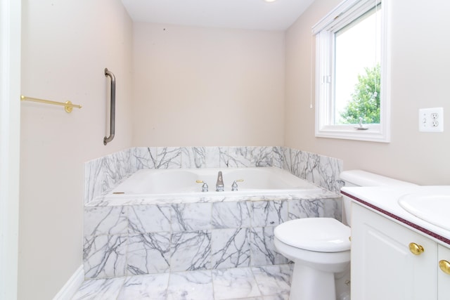 bathroom with a garden tub and vanity