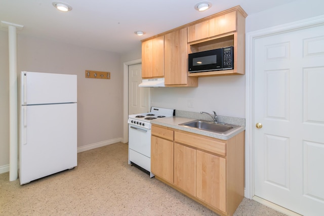 kitchen with white appliances, light countertops, a sink, and light brown cabinetry