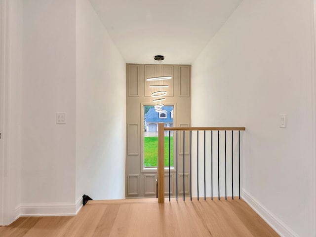 interior space featuring baseboards and wood finished floors