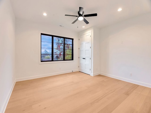 spare room featuring visible vents, baseboards, a ceiling fan, light wood-style flooring, and recessed lighting