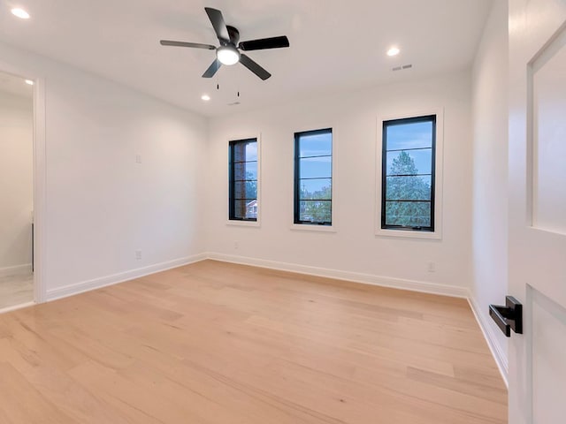 spare room featuring recessed lighting, baseboards, ceiling fan, and light wood finished floors