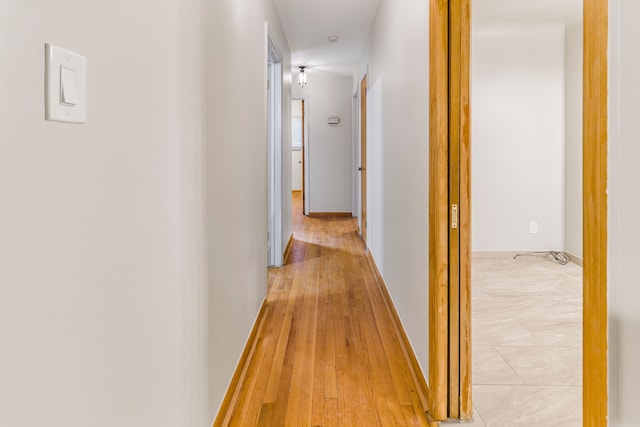 hallway with light wood-style flooring