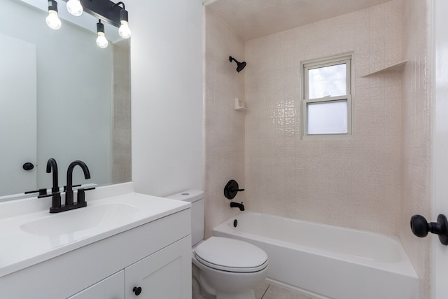 bathroom with washtub / shower combination, vanity, and toilet