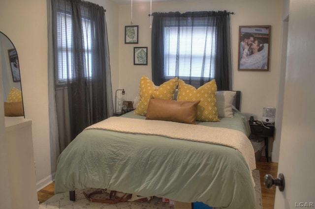 bedroom with wood finished floors