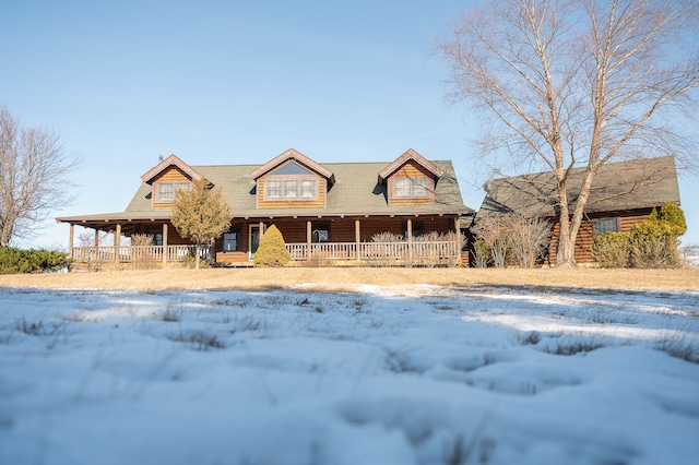 log cabin with a porch