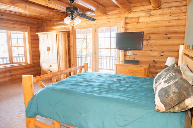 carpeted bedroom with wood ceiling and beam ceiling