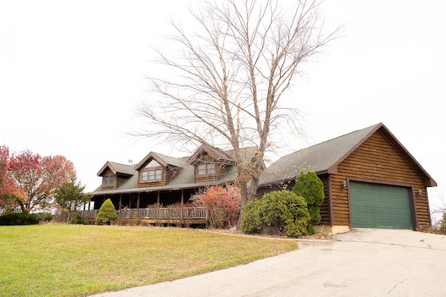 view of front of home with a garage, log exterior, a porch, and a front lawn