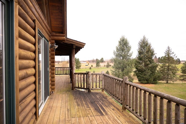 wooden deck featuring a rural view