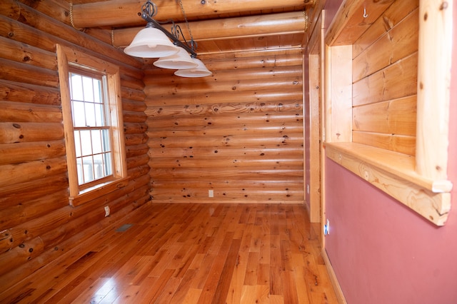 unfurnished room with light wood-style floors