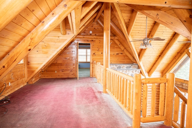 additional living space with lofted ceiling with beams, wood ceiling, and carpet flooring