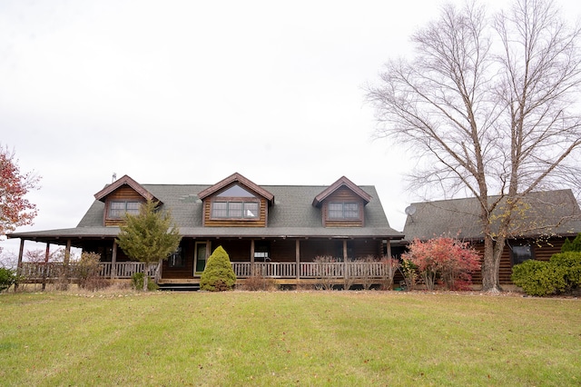 log cabin with a porch and a front lawn