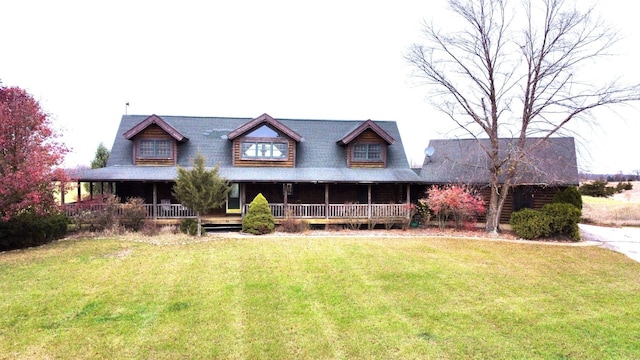 view of front facade with covered porch and a front lawn