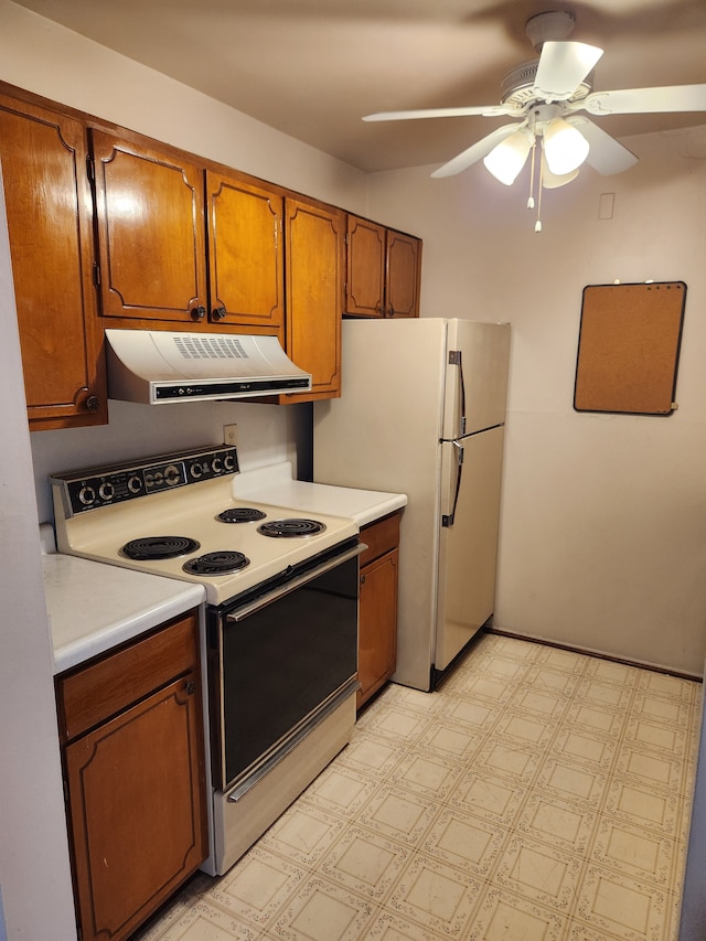 kitchen featuring range with electric cooktop, brown cabinetry, light floors, light countertops, and under cabinet range hood