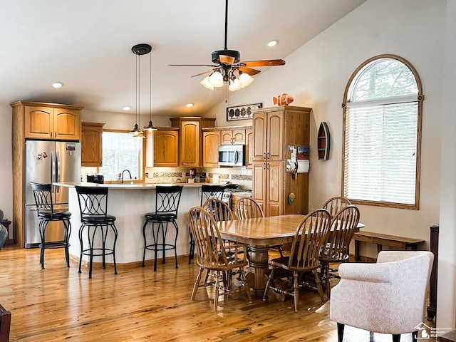 11799 Greenbriar Dr, Jerome, MI 49249 - dining area with ceiling fan, light wood-type flooring, recessed lighting, and high vaulted ceiling