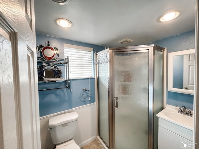 bathroom featuring visible vents, toilet, a shower stall, vanity, and tile patterned floors