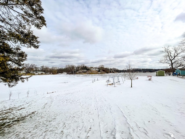 view of yard layered in snow