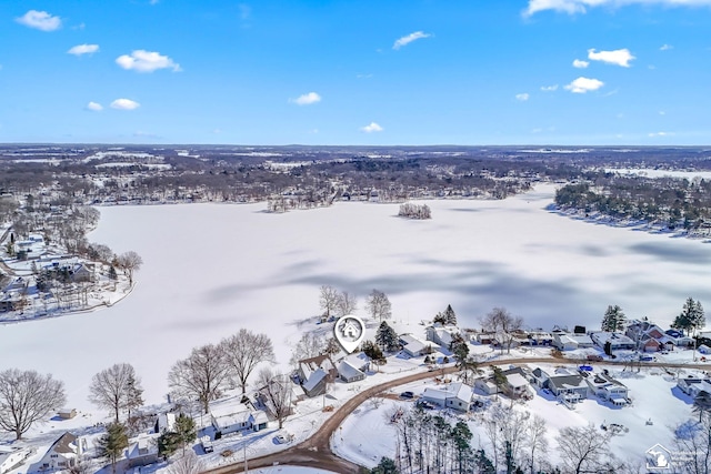 snowy aerial view featuring a residential view