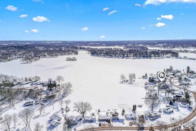 snowy aerial view with a residential view