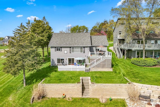 11799 Greenbriar Dr, Jerome, MI 49249 - rear view of property featuring a wooden deck, stairway, a yard, and a shingled roof