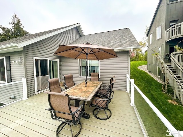 11799 Greenbriar Dr, Jerome, MI 49249 - wooden terrace featuring outdoor dining area and a lawn