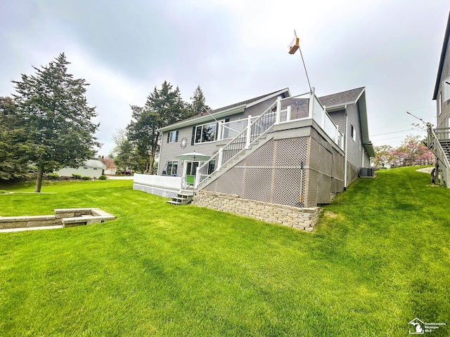 11799 Greenbriar Dr, Jerome, MI 49249 - rear view of property with a lawn, stairs, and cooling unit