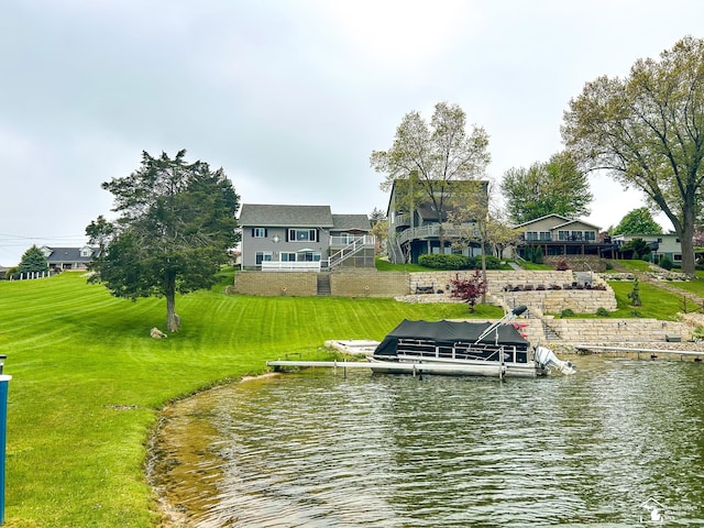 11799 Greenbriar Dr, Jerome, MI 49249 - dock featuring boat lift, a water view, and a yard