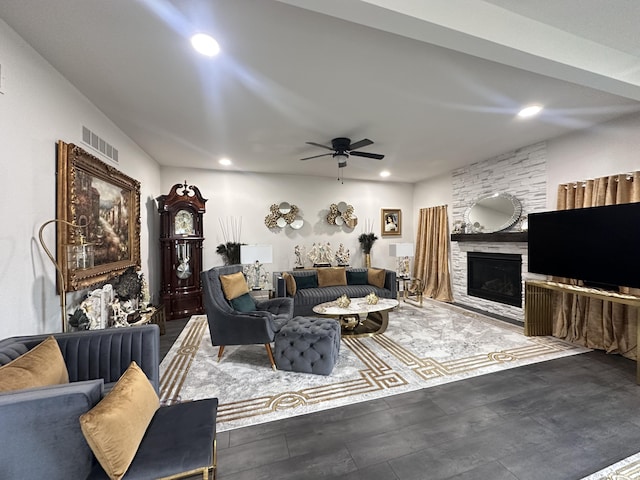 living room featuring recessed lighting, visible vents, ceiling fan, and a stone fireplace