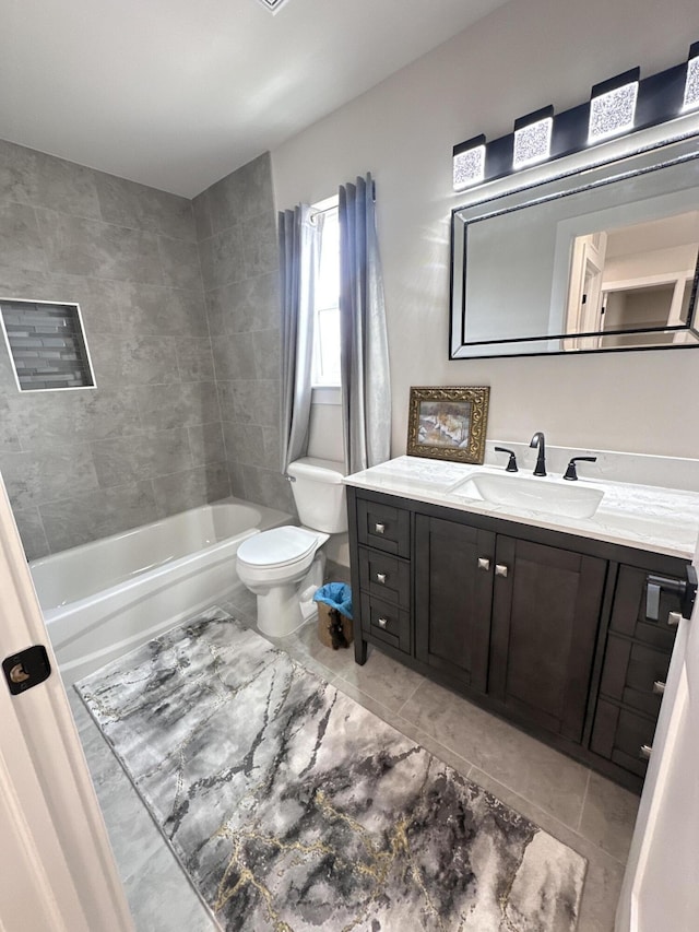 bathroom featuring toilet, shower / washtub combination, and vanity