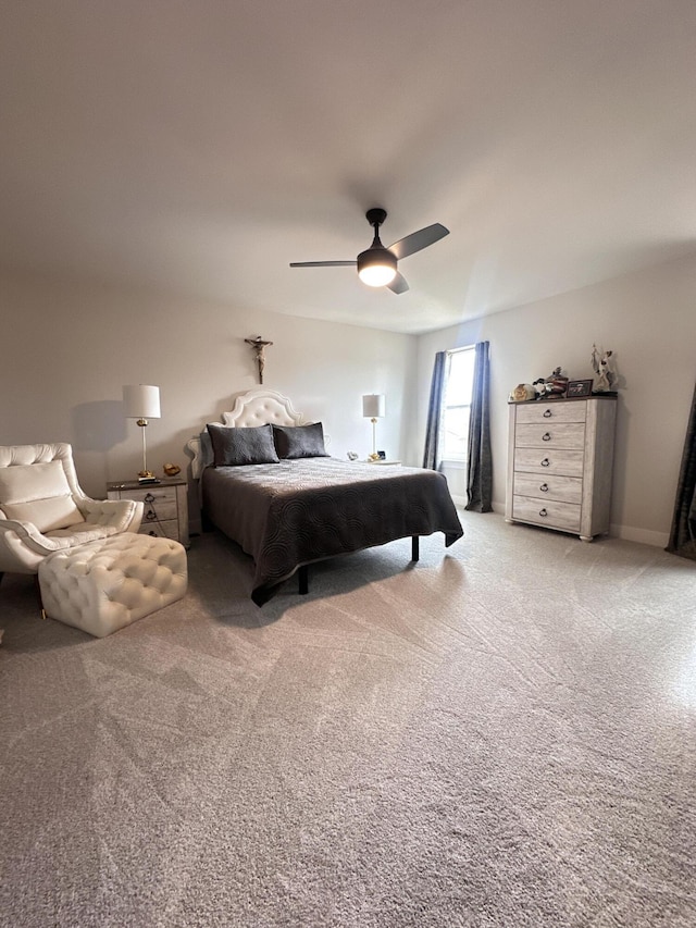 bedroom featuring a ceiling fan and light colored carpet