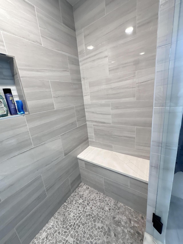 full bath featuring a shower stall