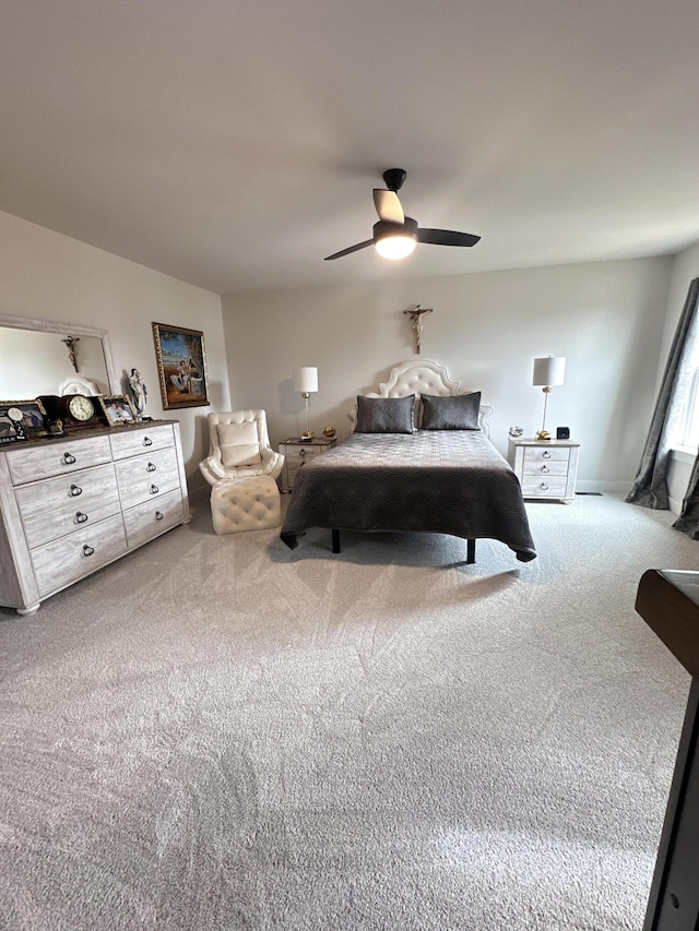 carpeted bedroom featuring a ceiling fan