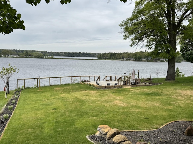 5855 Ridge St, Newaygo, MI 49337 - view of green lawn featuring a water view and a boat dock