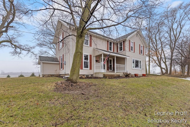 view of front facade with a porch and a front yard