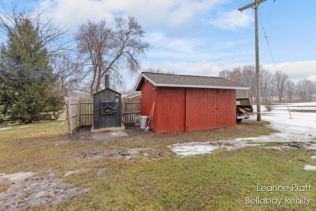 view of shed with fence