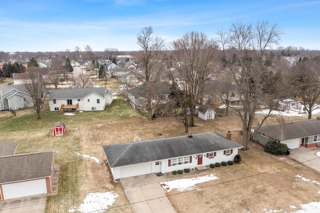 birds eye view of property with a residential view