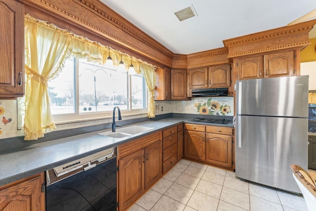 kitchen with ventilation hood, brown cabinets, a sink, and black appliances