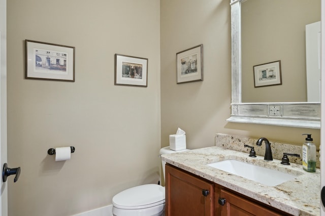 half bath with vanity and toilet