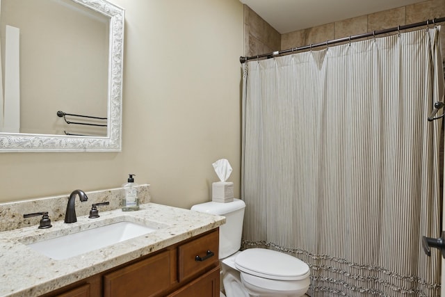 full bathroom with vanity, toilet, and a shower with curtain