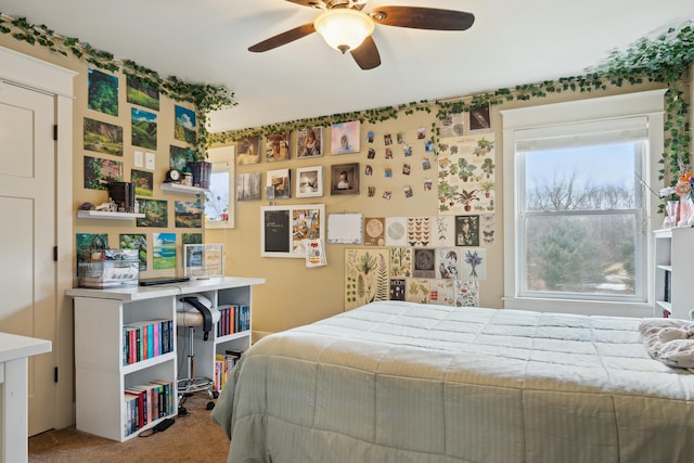 carpeted bedroom featuring ceiling fan